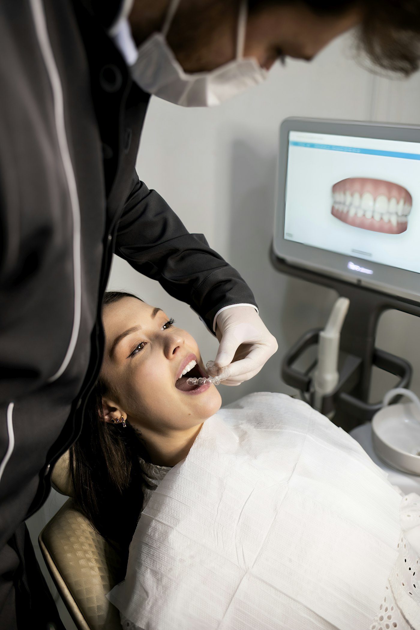 Northline Dental clinician fitting a clear aligner for a patient