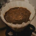 Ground coffee blooming in a paper filter
