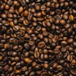 A dense pile of roasted coffee beans