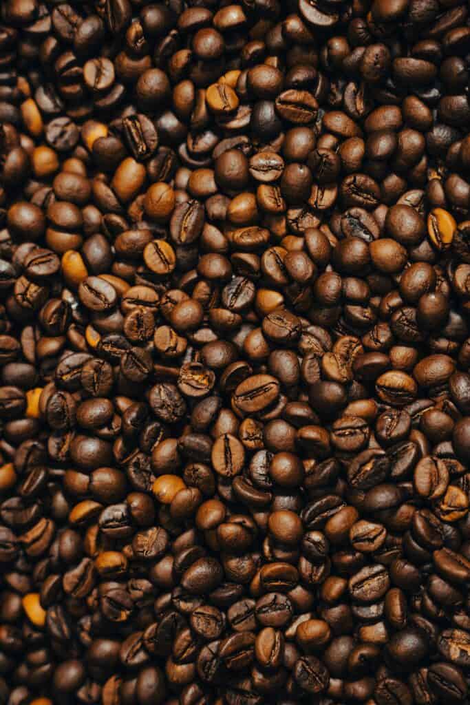 A dense pile of roasted coffee beans