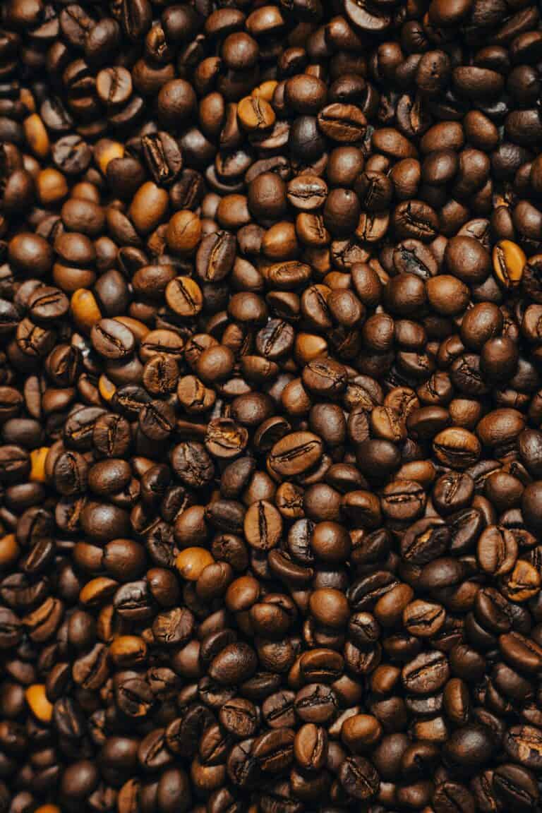 A dense pile of roasted coffee beans