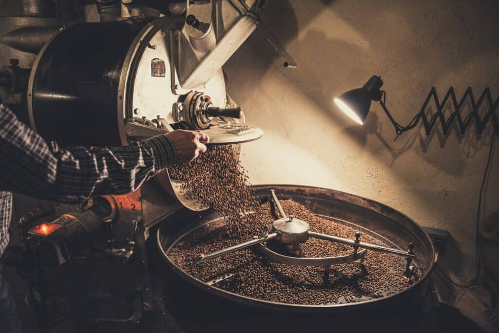 Beans tumbling in the drum of a coffee roaster