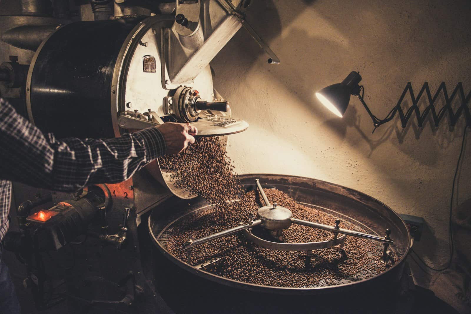 Beans tumbling in the drum of a coffee roaster